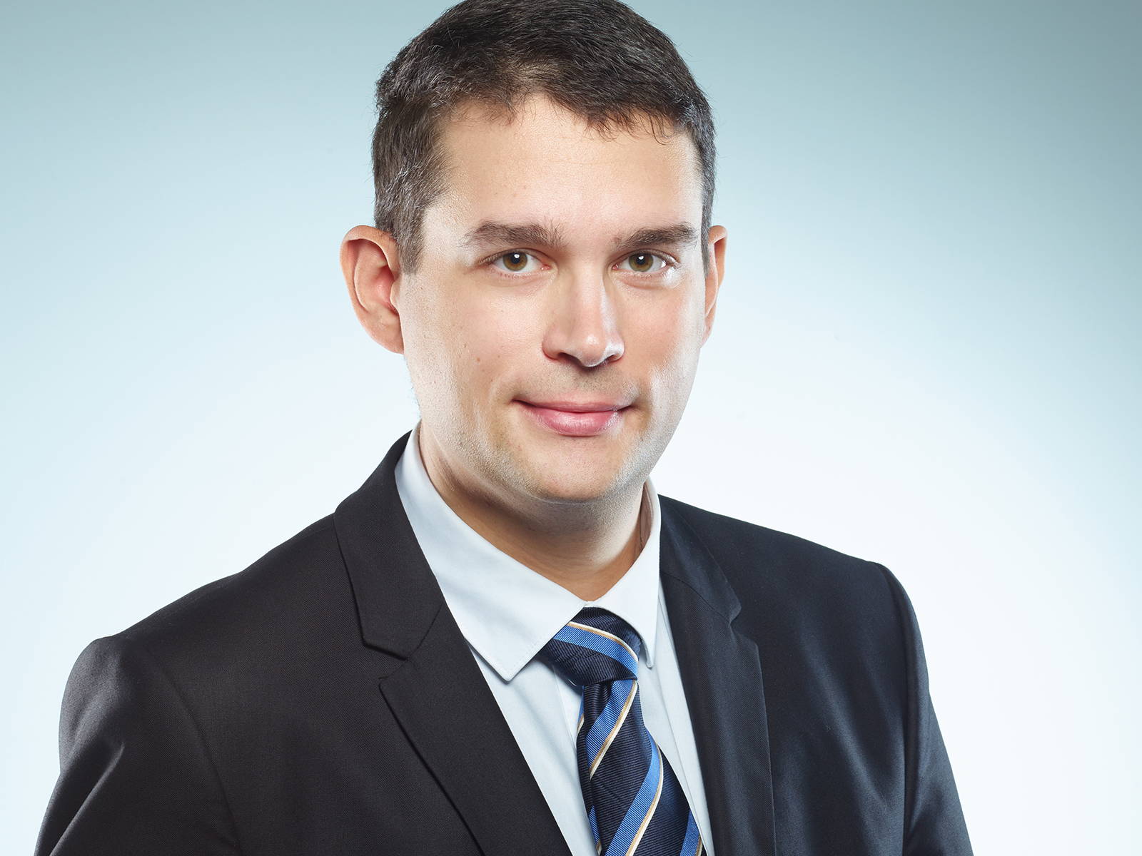 Professor Volker Presser is pictured wearing a dark suit