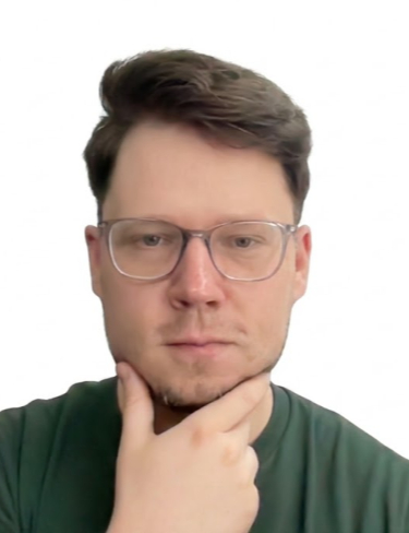 Martin Fitzner looking directly forward with a thoughtful expression while resting his chin on his hand, set against a plain white background framed by black borders.