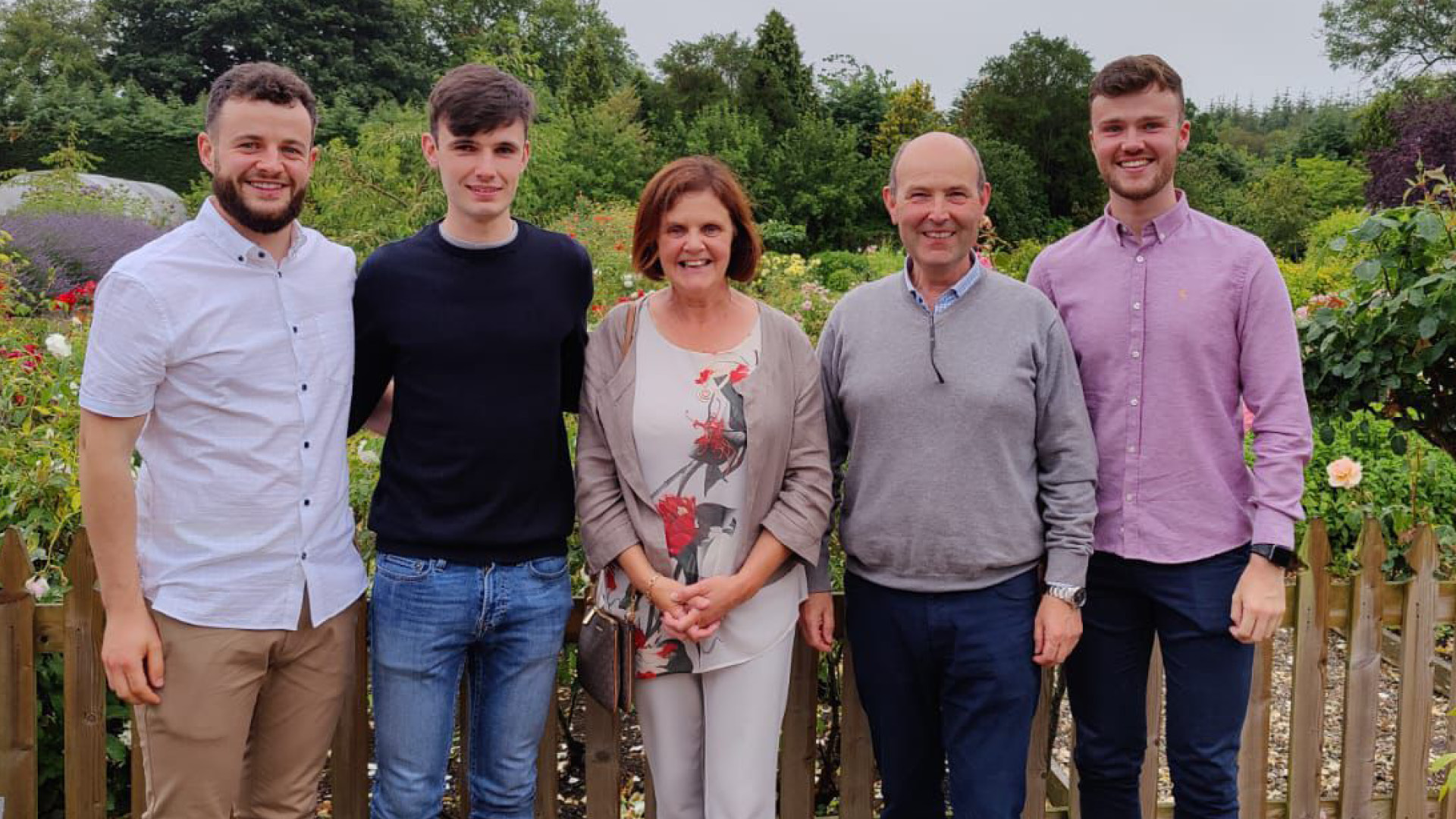 Conor Eivers with colleagues smiling to camera