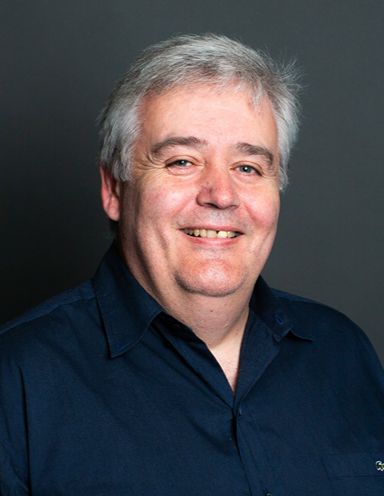 Headshot of Tony James