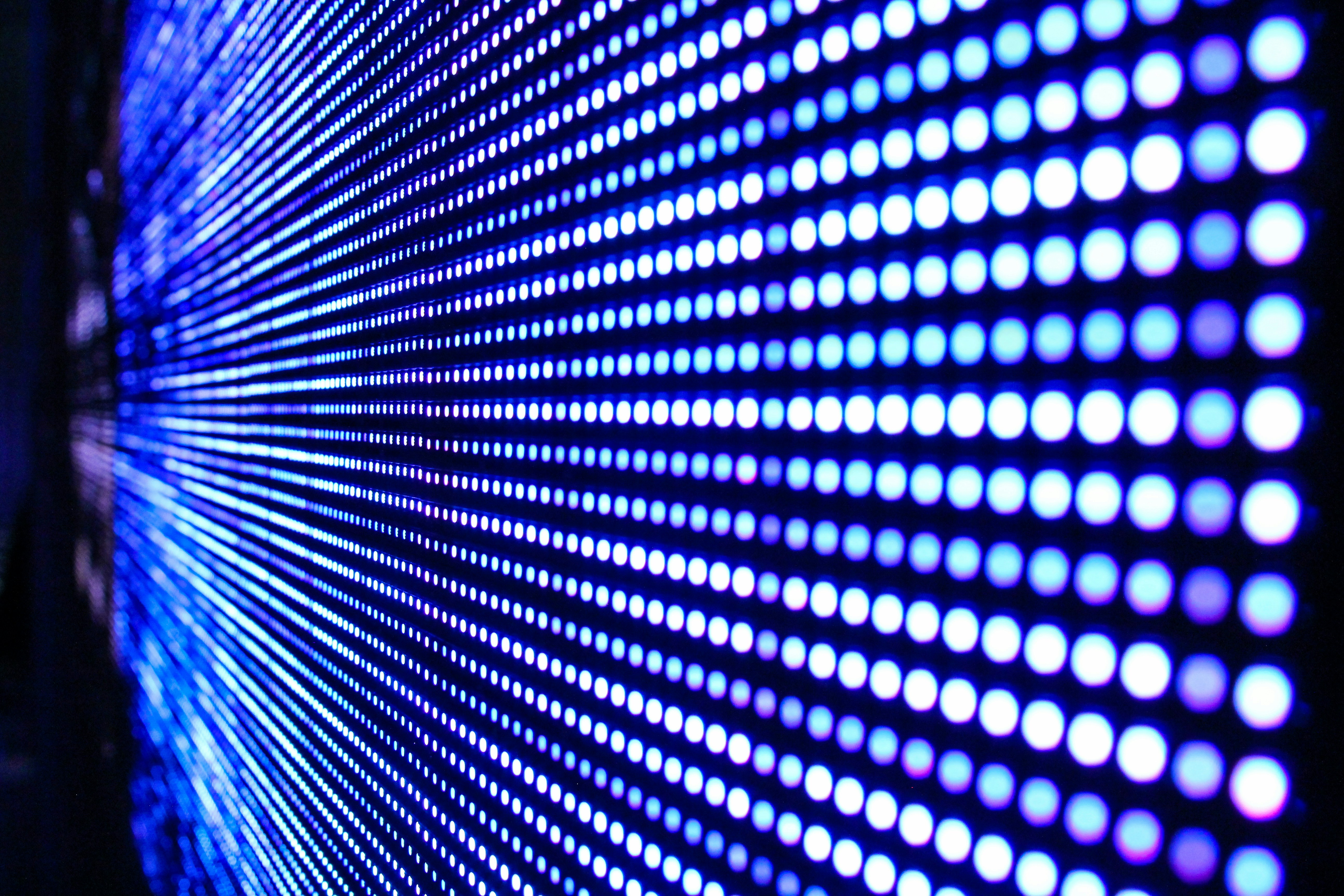 The image features colourful molecular structures and a glowing crystal ball held in robotic hands.