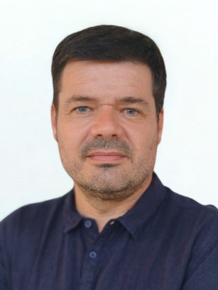 Antonio González-Sarrías looking directly, wearing a dark navy blue shirt against a plain white background. 
