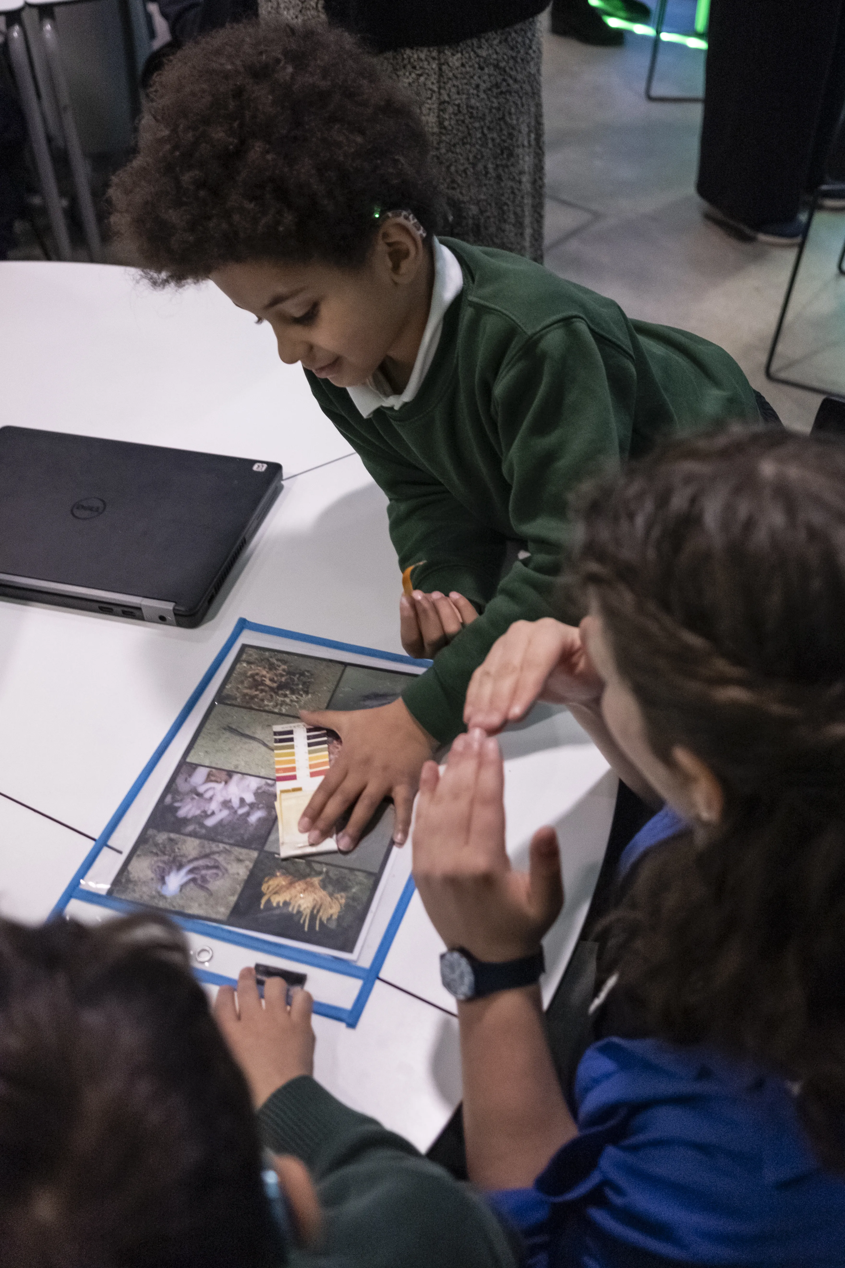 Deaf Science day - workshop - credit Robin Mair Photography a group of kids sitting at a table