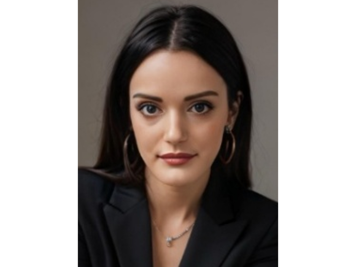 Serena Arnaboldi with long hair wearing a black blazer