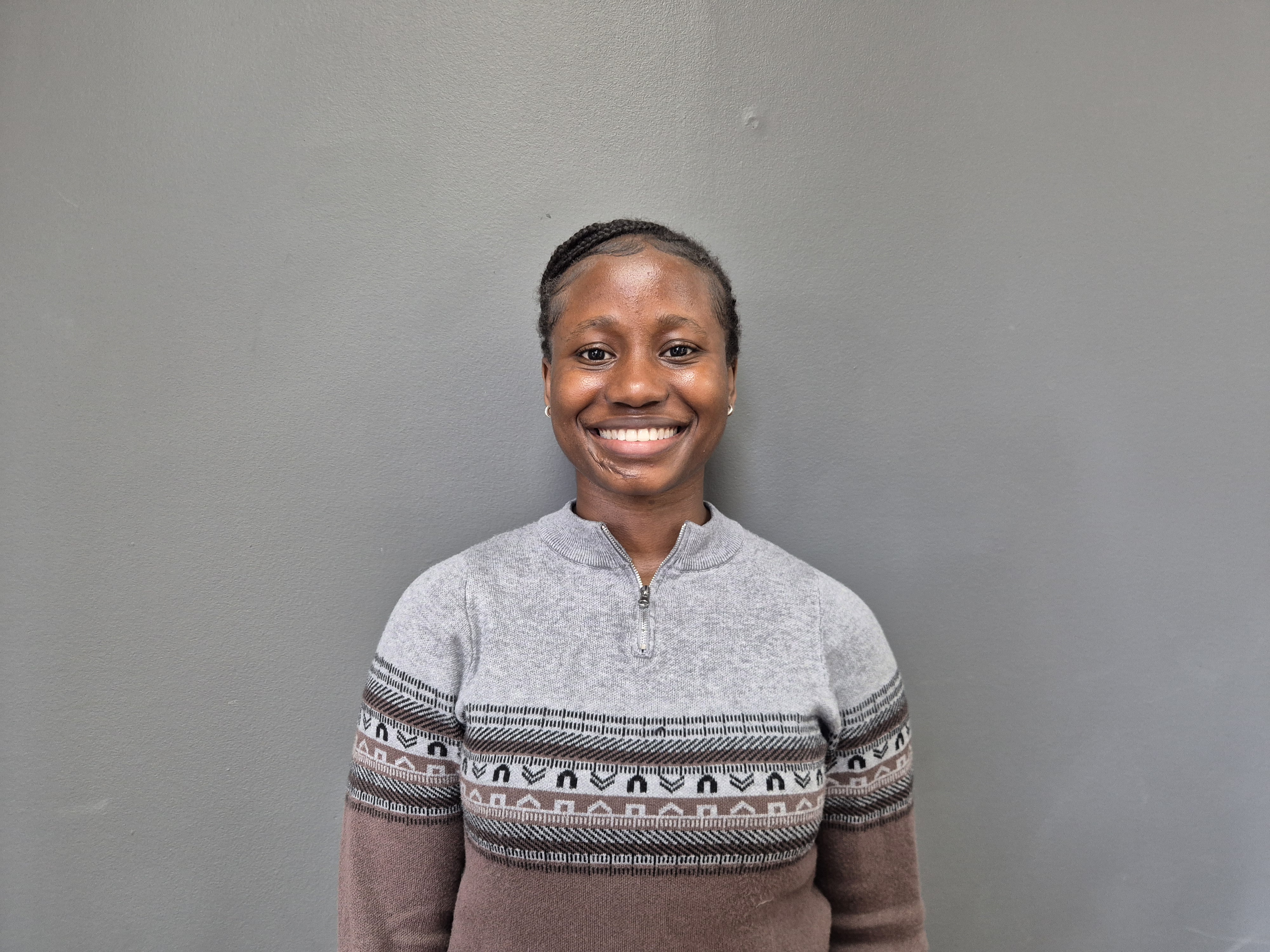 Damilola Oduneye smiles at the camera