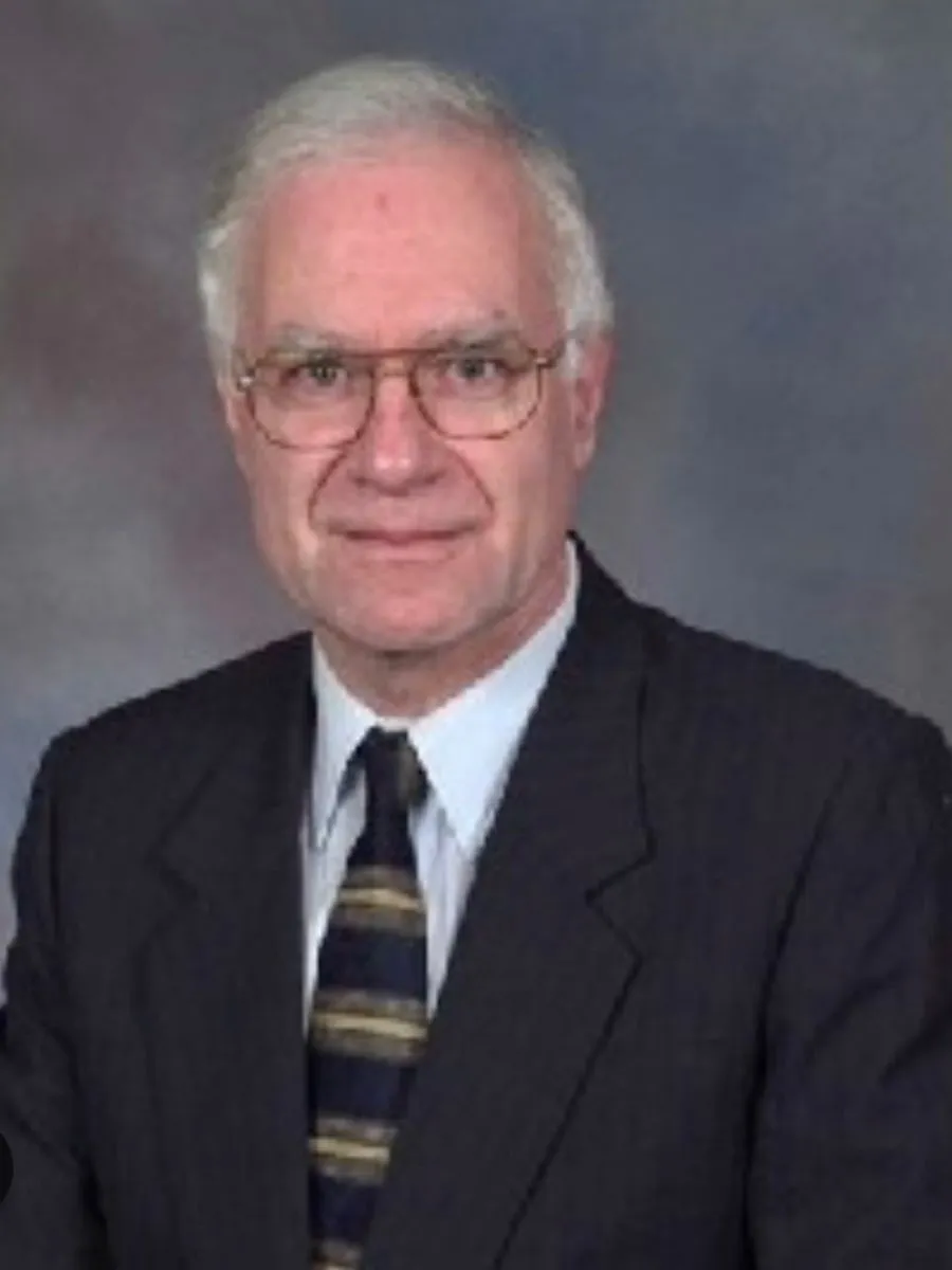 Clive Hamlin - deceased Clive Hamlin smiling to camera in dark suit, shirt and tie