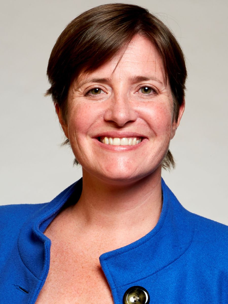 Professor Rachel O’Reilly in a blue shirt smiling for the camera