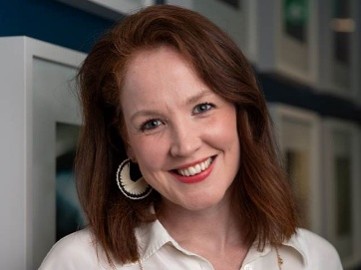 a woman smiling at the camera