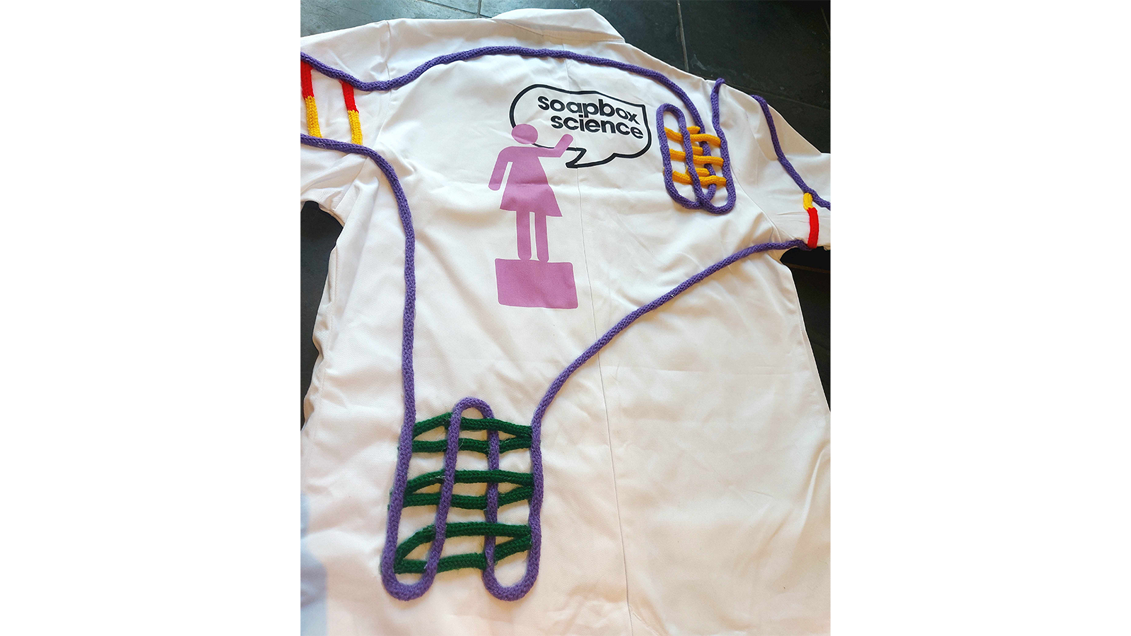 Zoe's chemically drawn on lab coat laid out flat