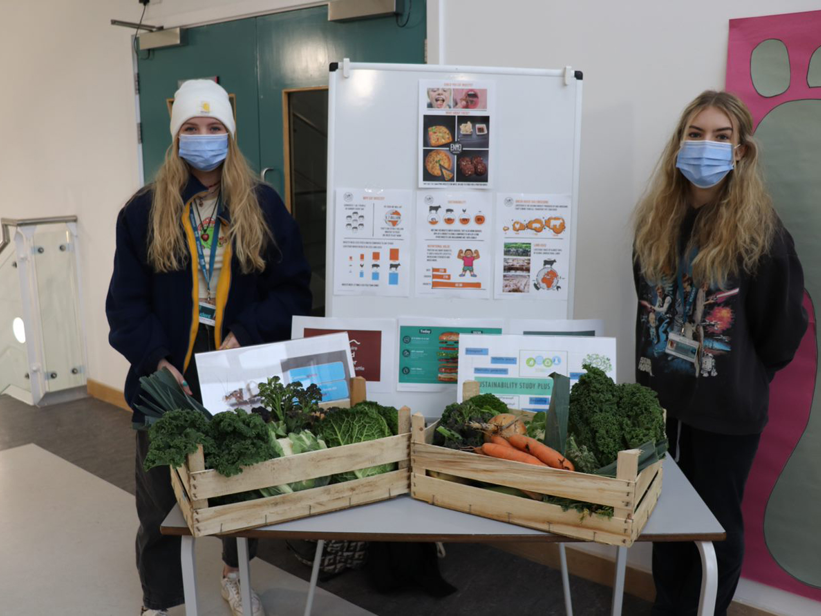 Two women from Callywith College Sustainability Group with their promotional stand