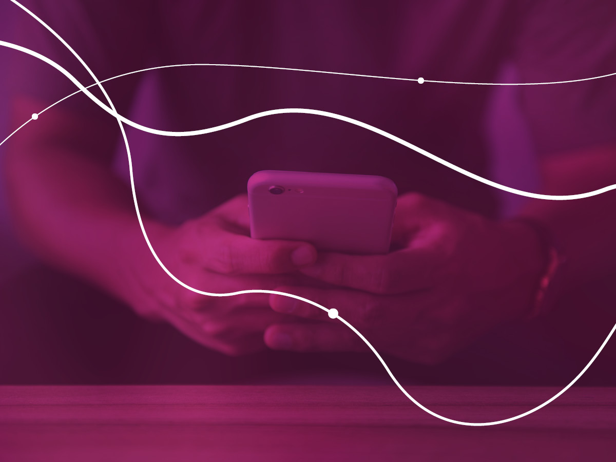 A person holds a mobile phone in their hands