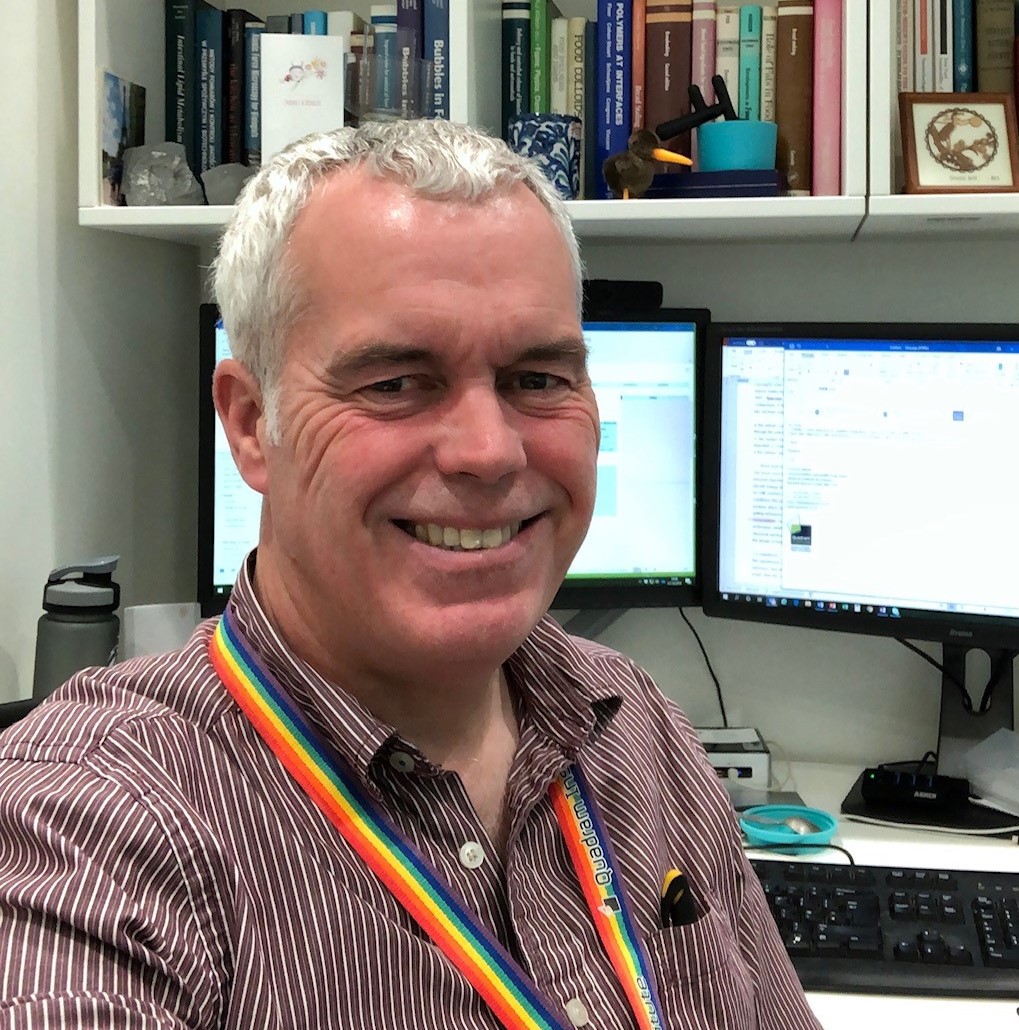 a man smiling at camera