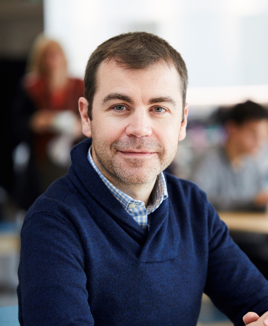 a man in a blue sweater