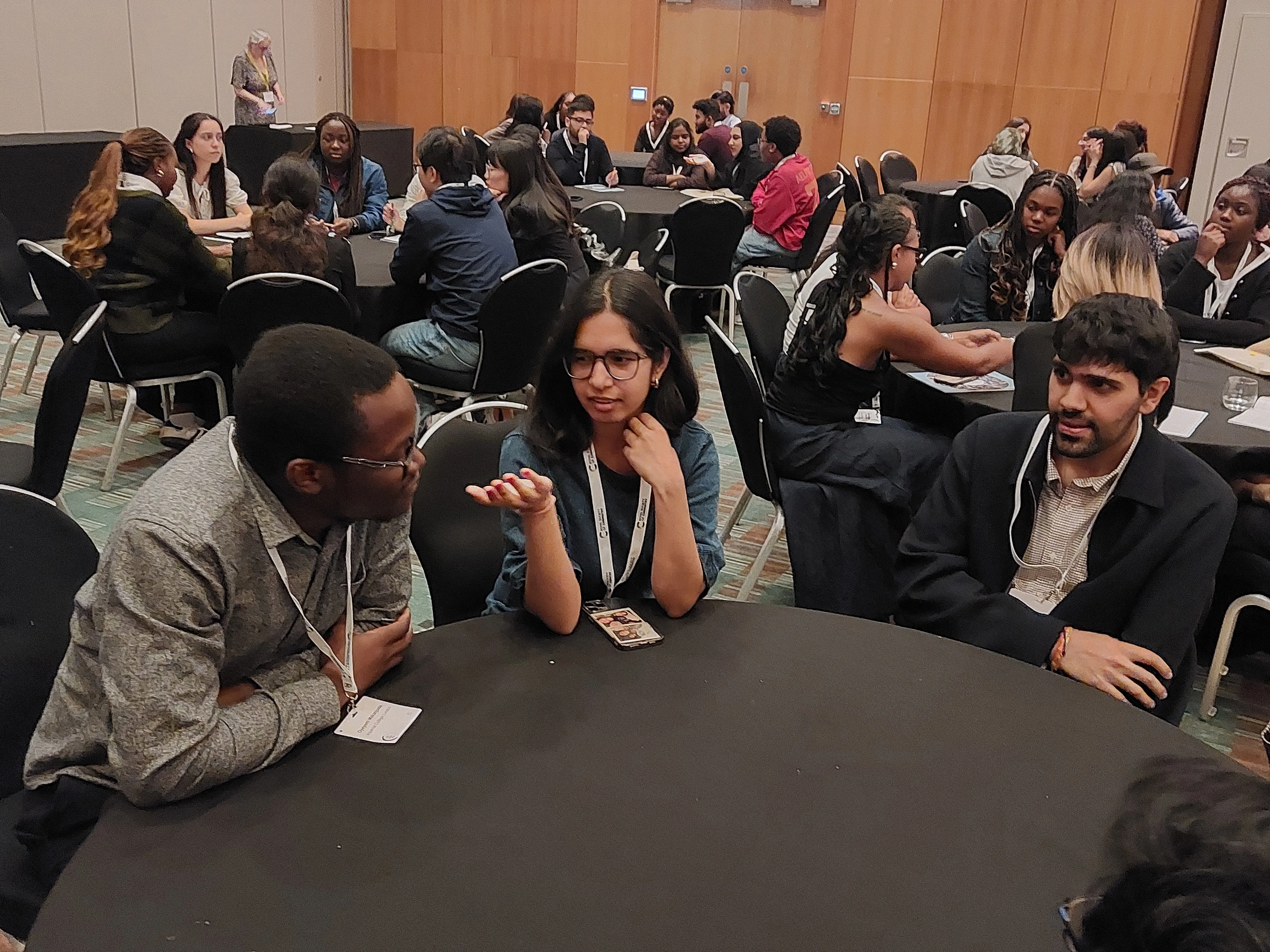 Broadening Horizons 5 - networking practice a group of people sitting at a round table