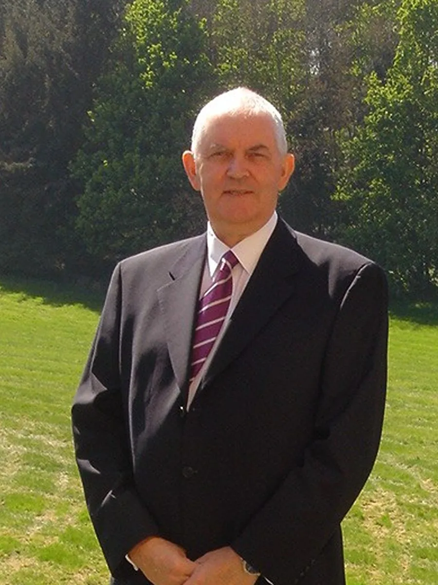 Albert McGill - deceased Albert McGill smiling to camera in suit and tie