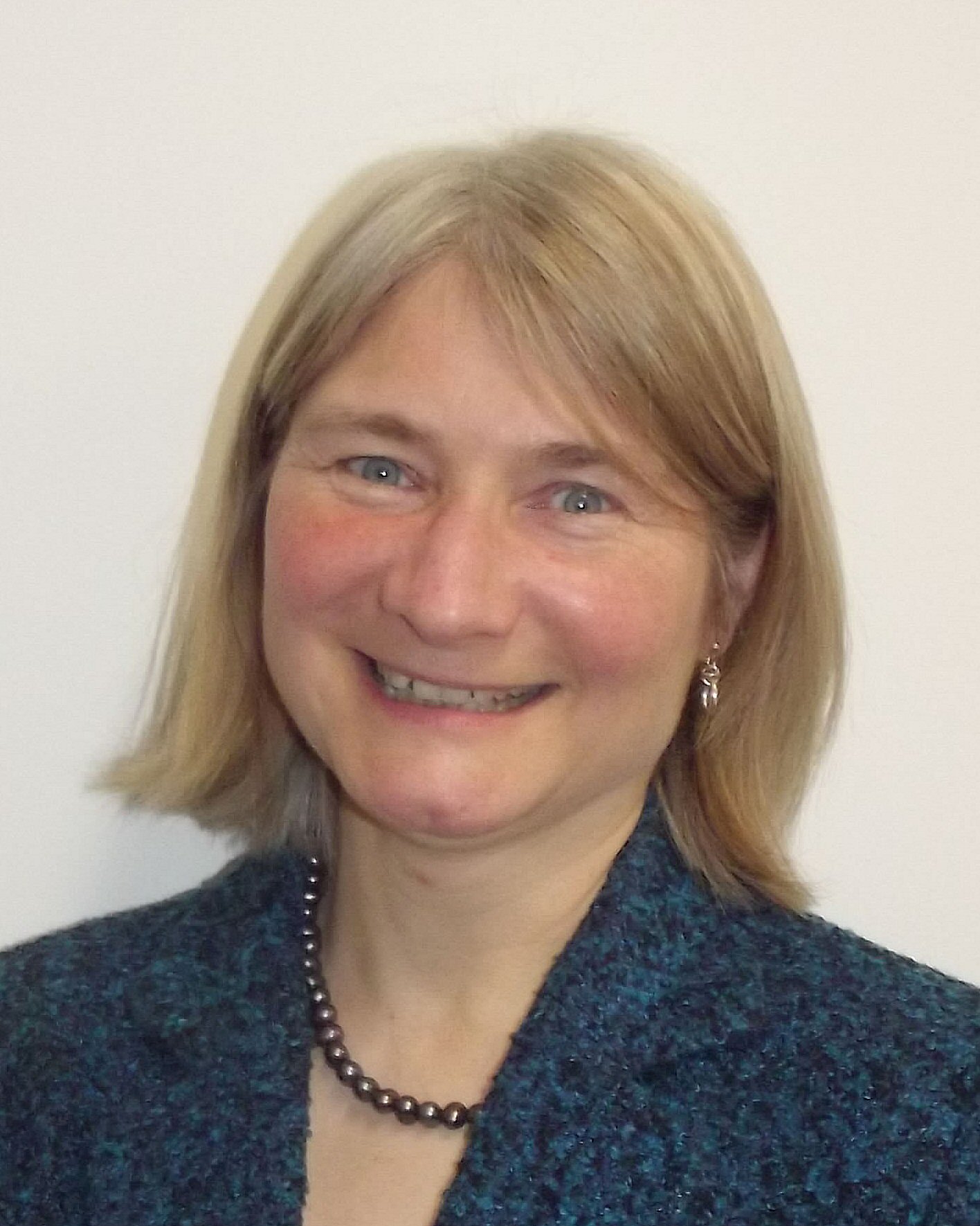 A smiling portrait photograph of Alison Wall, Deputy Director, Talent and Skills, UKRI-EPSRC