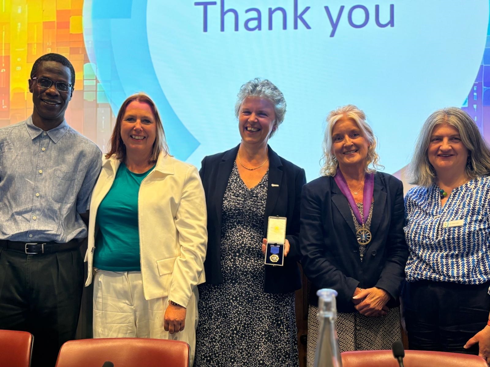 RSC president-elect Professor Robert Mokaya, honorary treasurer Claire Gallery-Strong, former president Professor Gill Reid, new president Dr Annette Doherty and CEO Dr Helen Pain stand side by side in front of a screen that reads 'thank you'