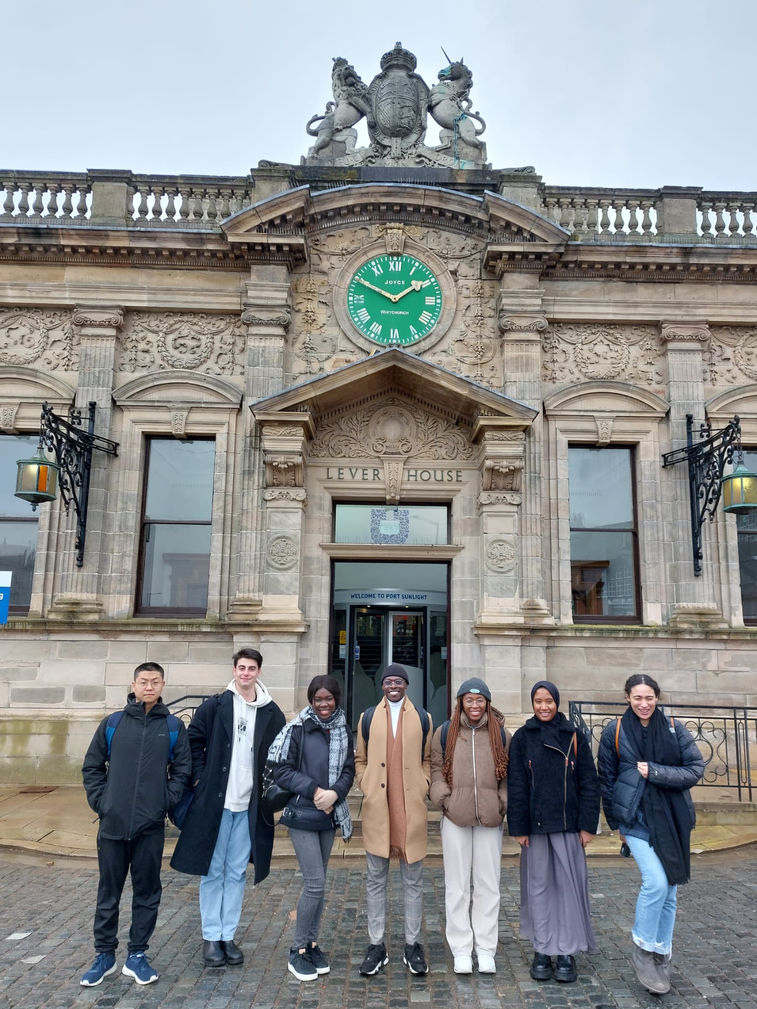 Jaime Moreno (second left) and Carla Aldington (right) stand outside one of Unilever's buildings in Port Sunlight