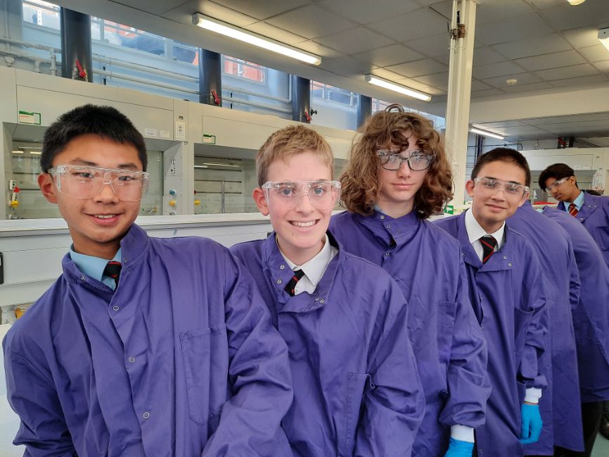 The team from Magdalen College School pose in the laboratory