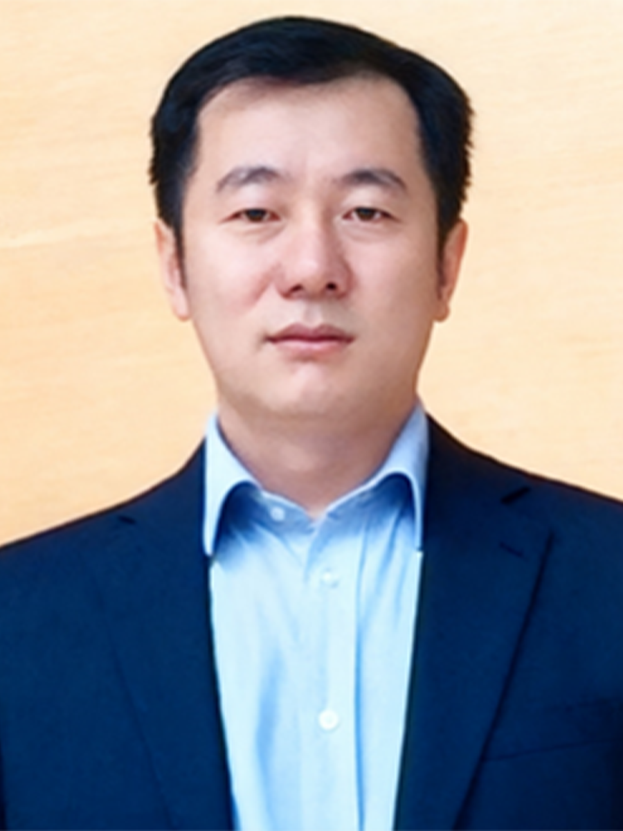 Haijun Yu to camera in blue shirt and navy suit jacket