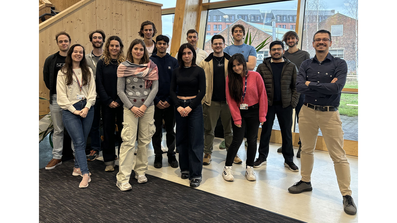 Dr Mattia Silvi with group of people posing for a photo in office building