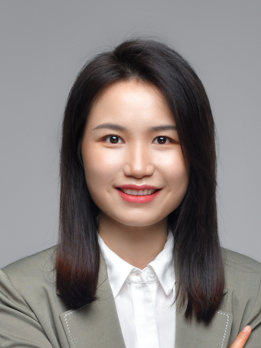 Tingyu Huang smiling to camera, headshot