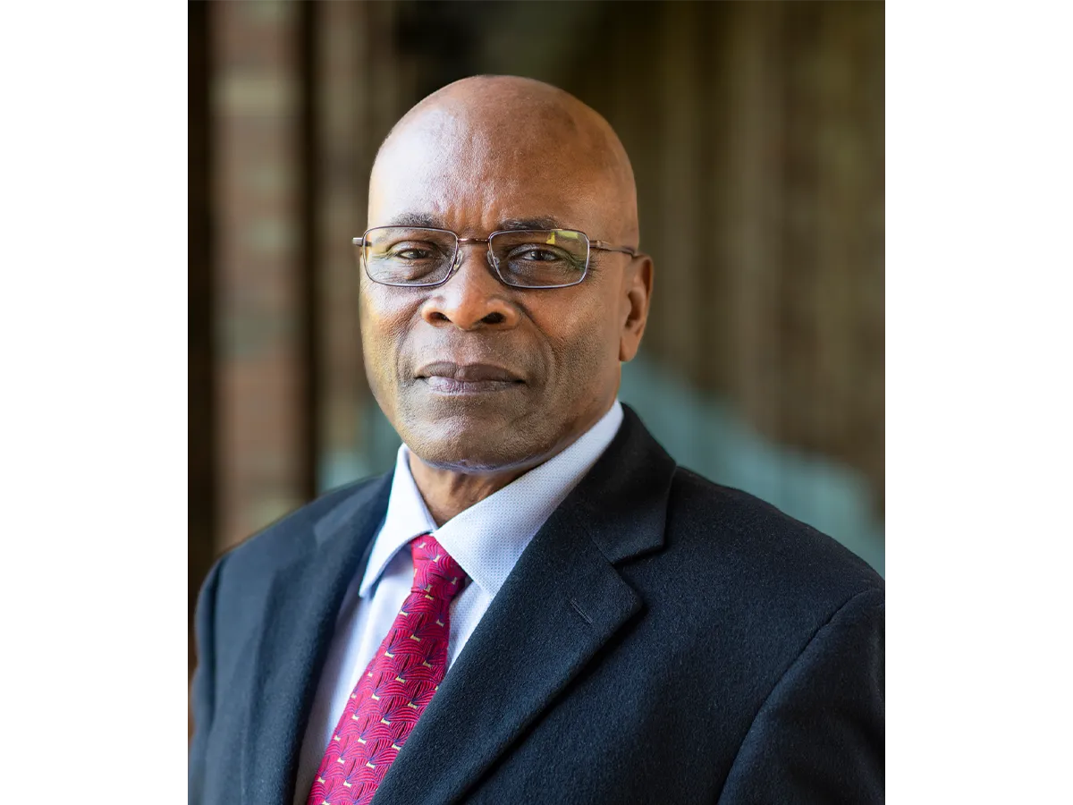 Professor Samson Jenekhe in a suit and tie and wearing glasses