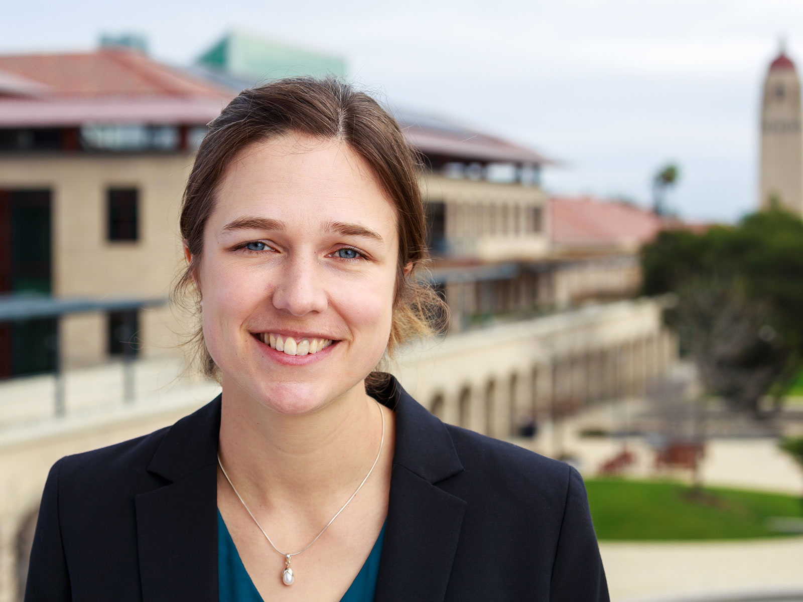 Laurie King is Senior Lecturer at Manchester Metropolitan University. Laurie is pictured outdoors smiling at the camera.