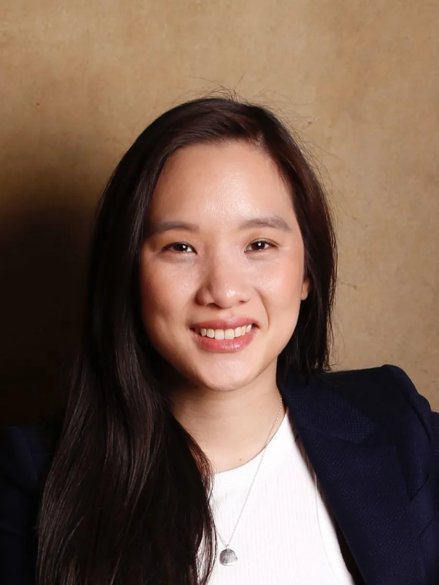 1. Huynh - Headshot Dr Florence Huynh in a suit, smiling