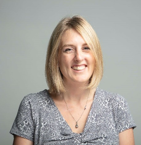 a woman smiling for a picture