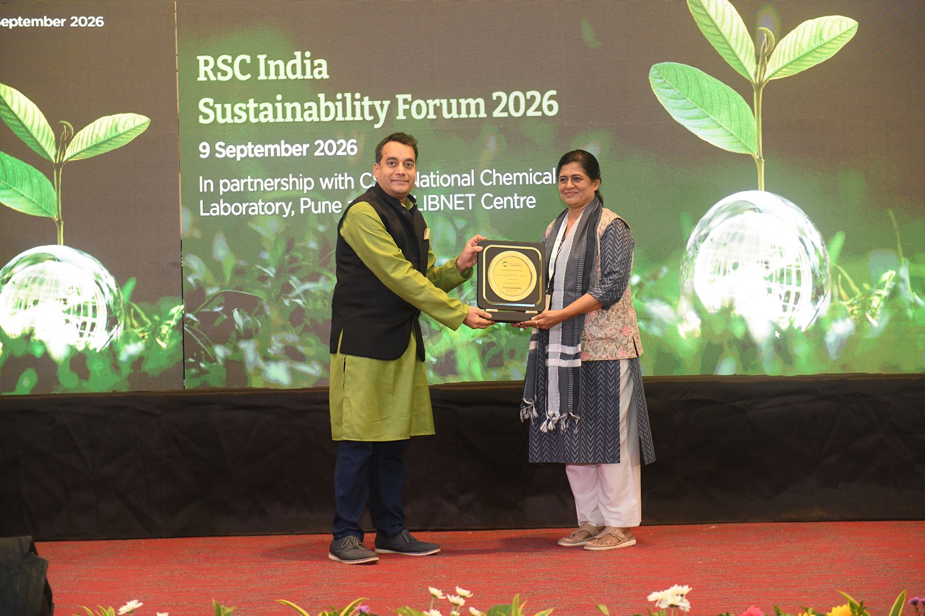 Dr Venkatesh Sarvasiddhi and Dr Devika Madali - RSC India Sustainability Forum 2026 RSC India MD Dr Venkatesh Sarvasiddhi presented a token of thanks to keynote speaker Dr Devika Madali, Director of INFLIBNET Centre