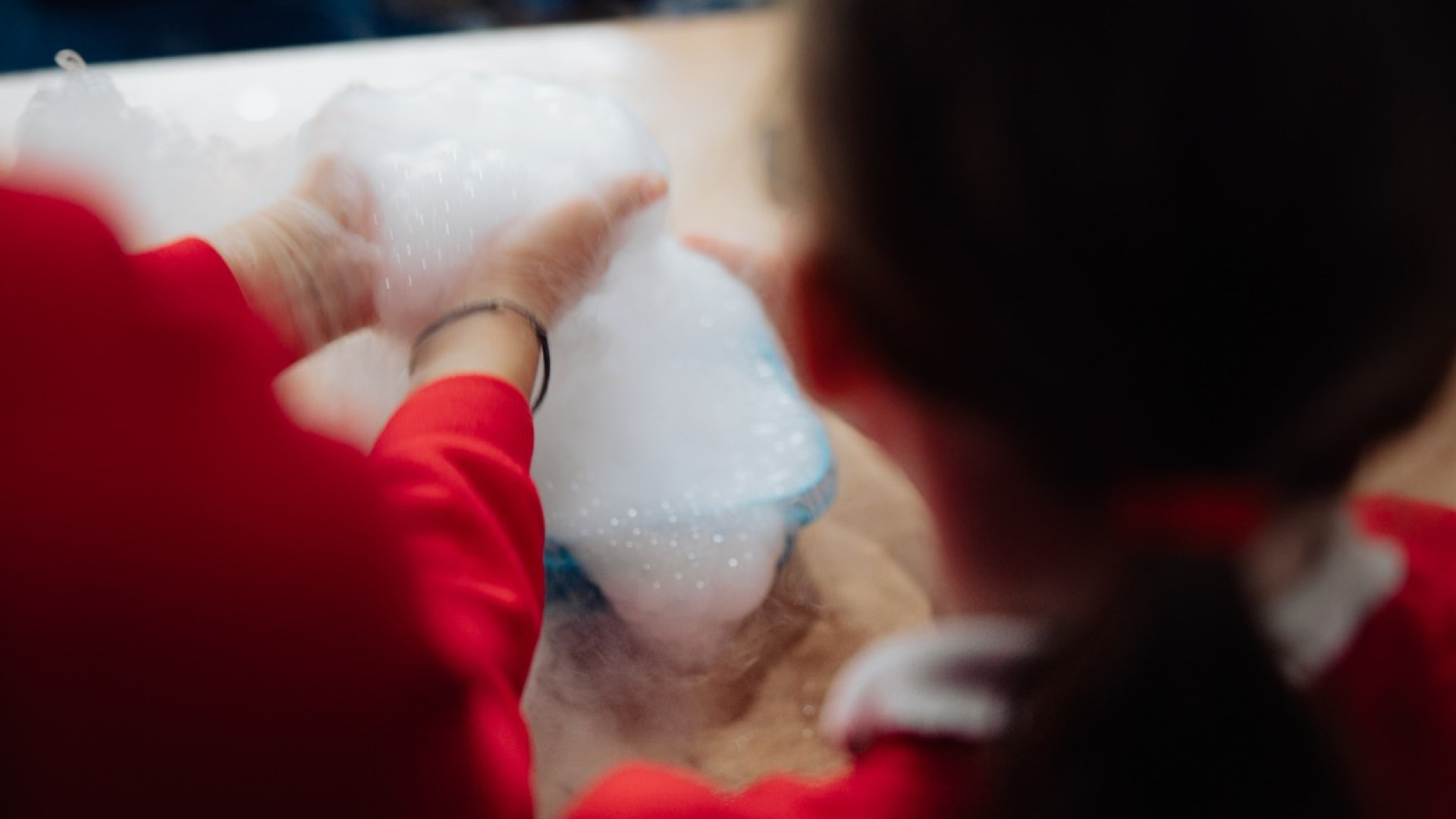 Schooll children creating soap foam at the Humber STEM event 2025