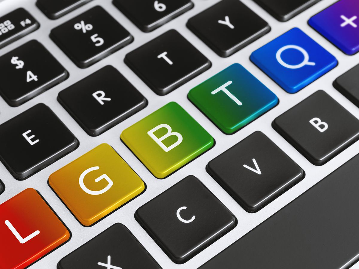 a close up of a keyboard showing the keys LGBTQ next to each other in rainbow colours