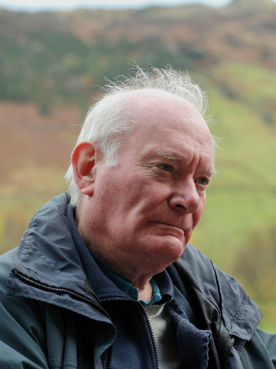 Dr Christopher Lawson outside in countryside