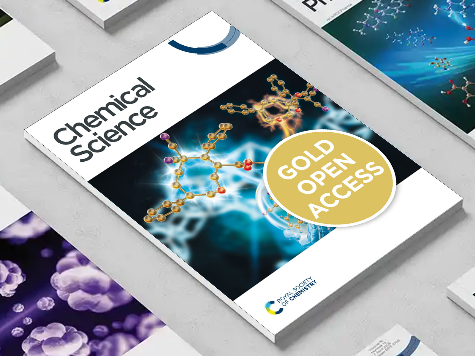 the Chemical Science journal among a group of other journals on a desk