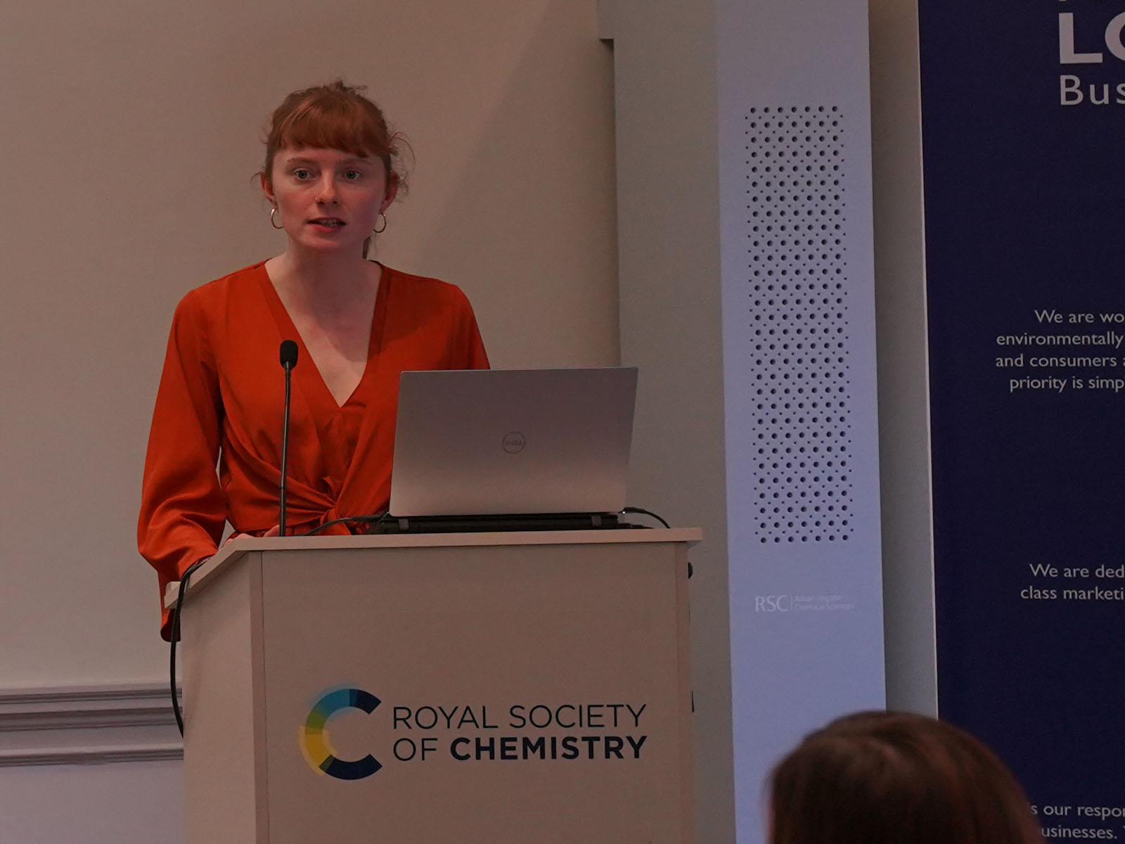 Orlaith O'Byrne speaks from behind a lectern