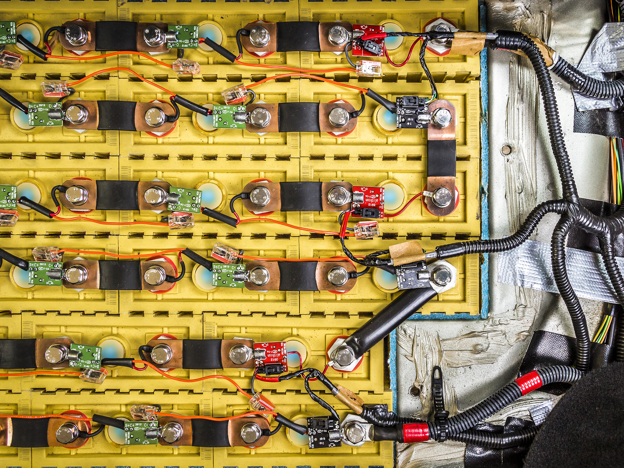 closeup of rechargeable battery pack installed in electric car 