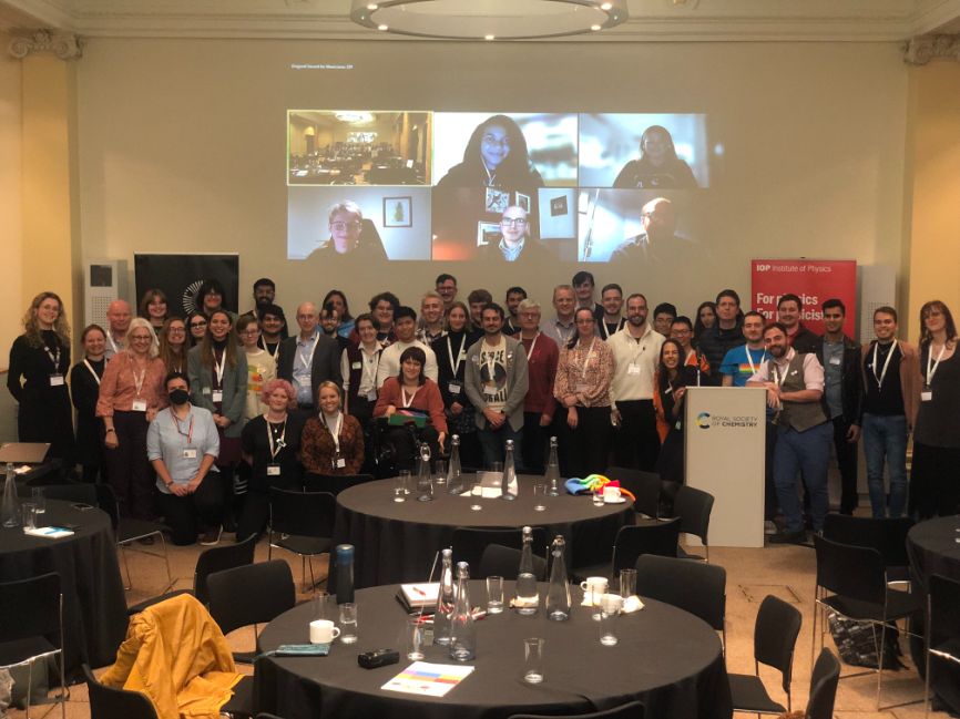 Attendees at a special LGBT+ STEM Day event pose for a picture at Burlington House in November 2022