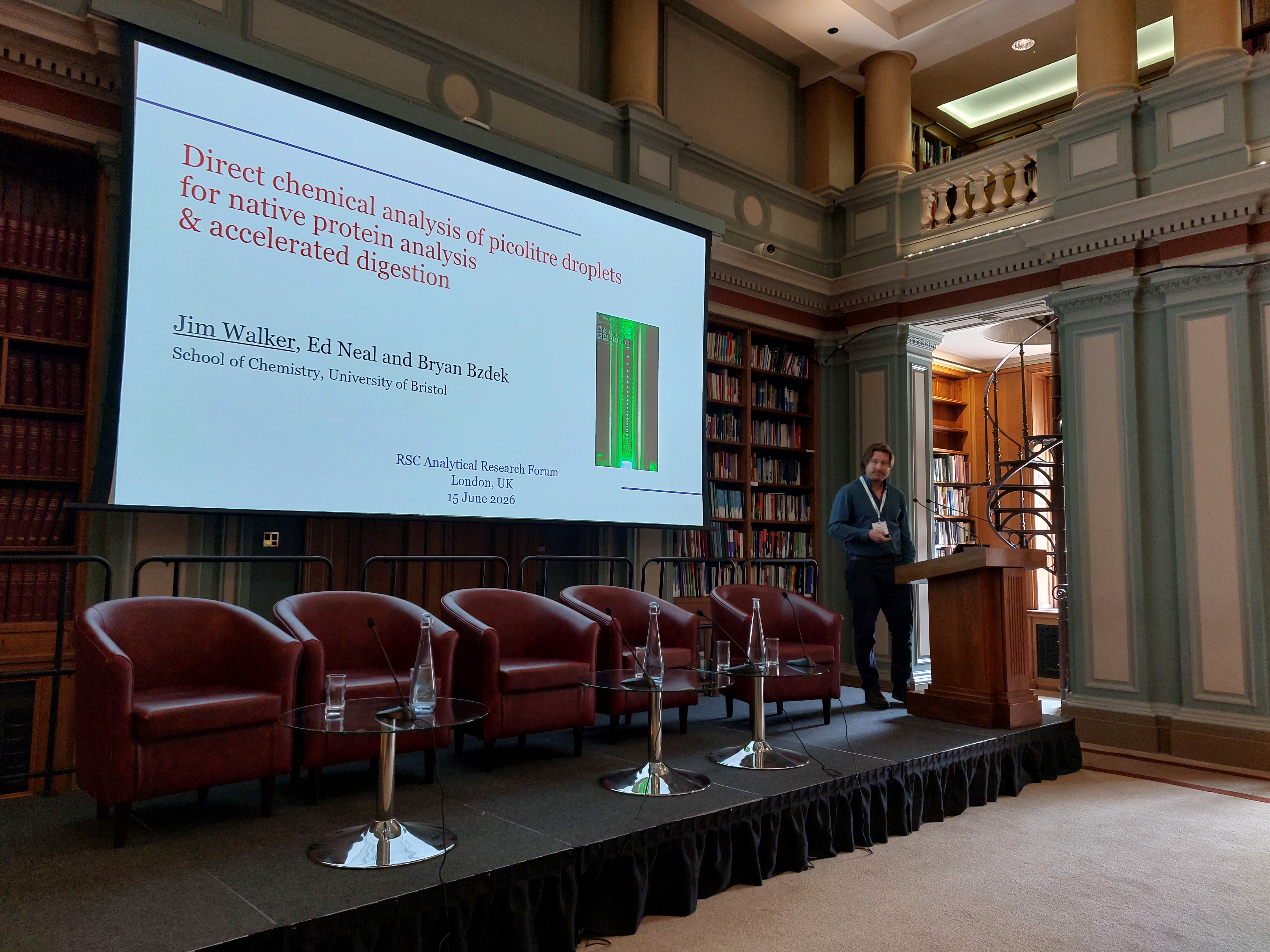 Analytical Research Forum 2026 - Jim Walker Jim Walker presents to the group from behind a lectern