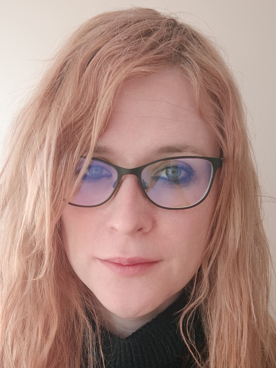 Ellis Crawford to camera wearing glasses, headshot