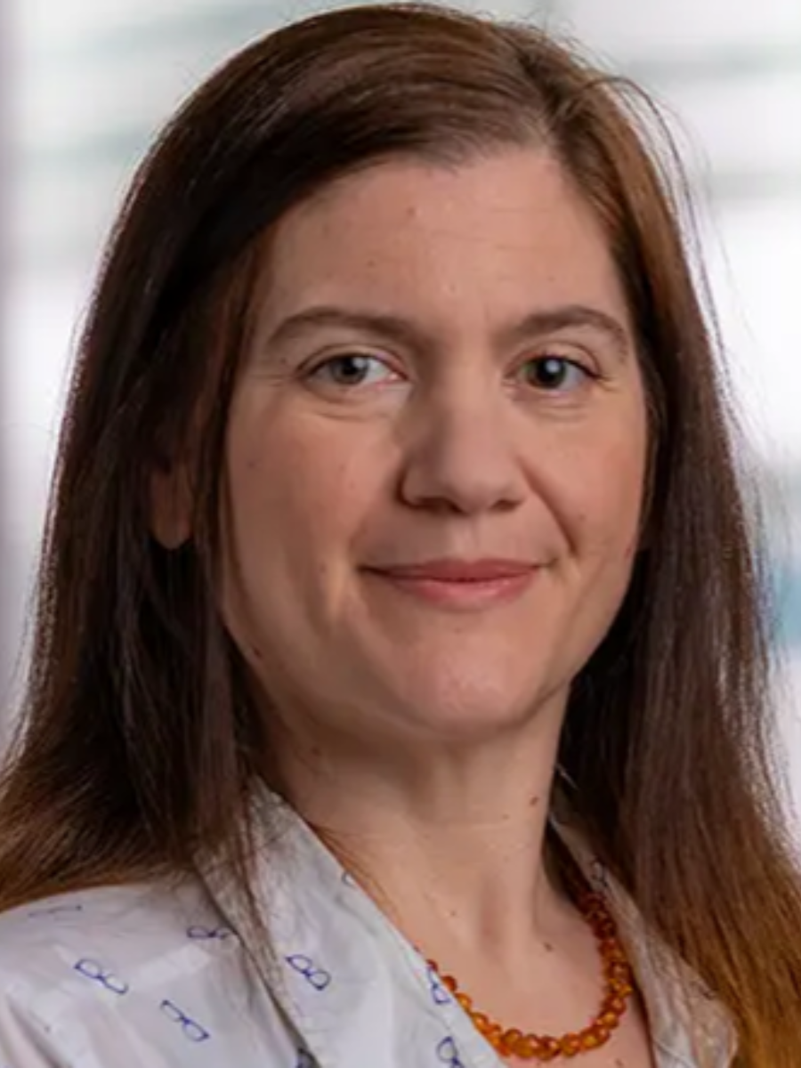 Francesca Taraballi smiling to camera, long brown hair